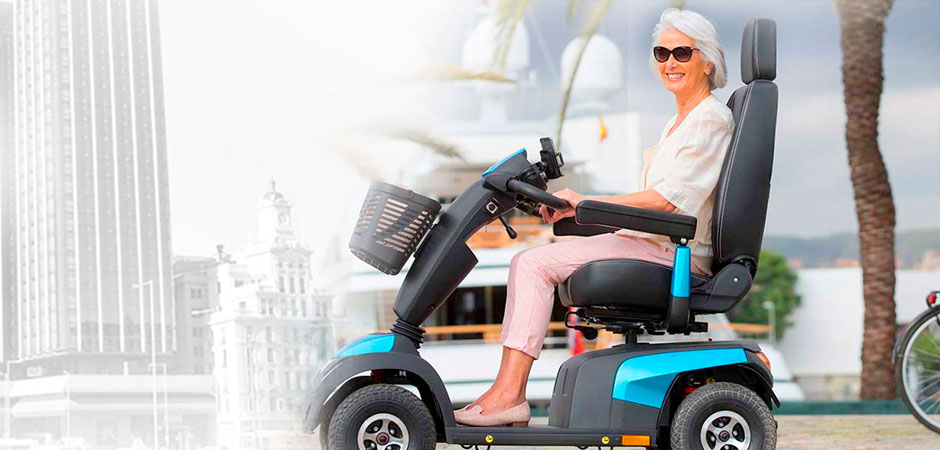 A woman is sitting on a mobility scooter